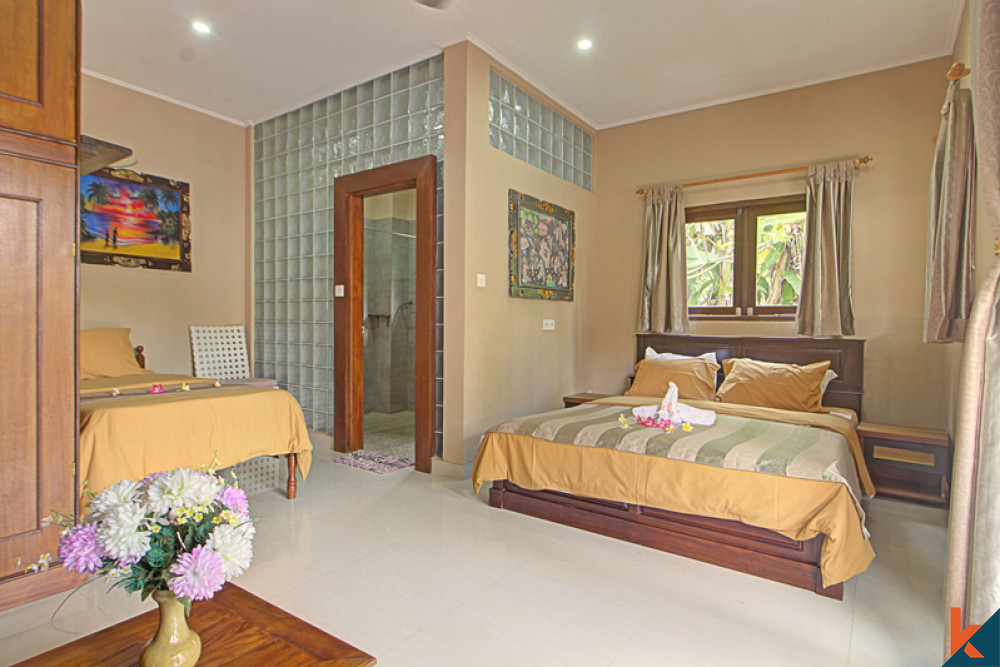 A spacious bedroom in a Bali villa